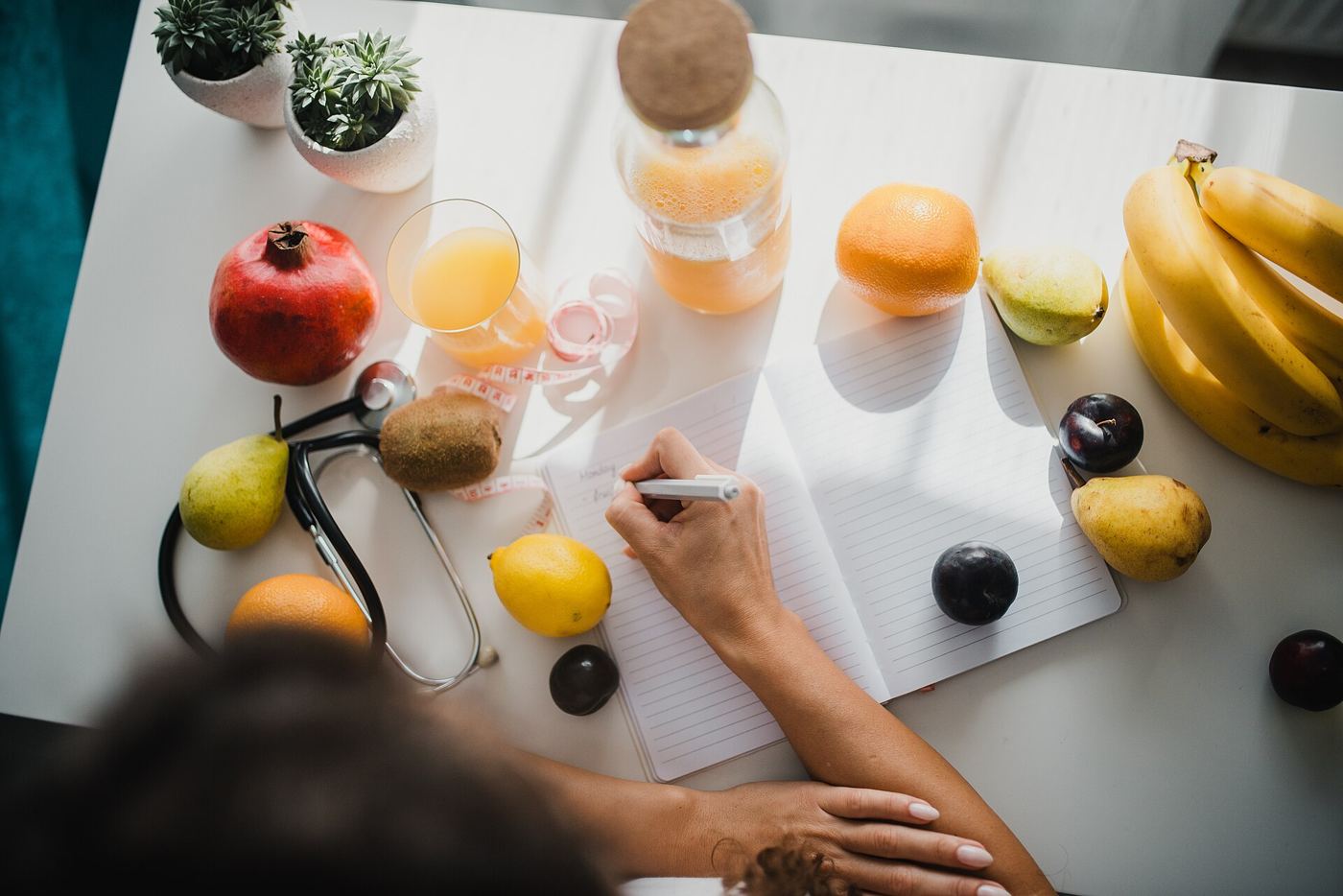 notebook and pen on a kitchen table