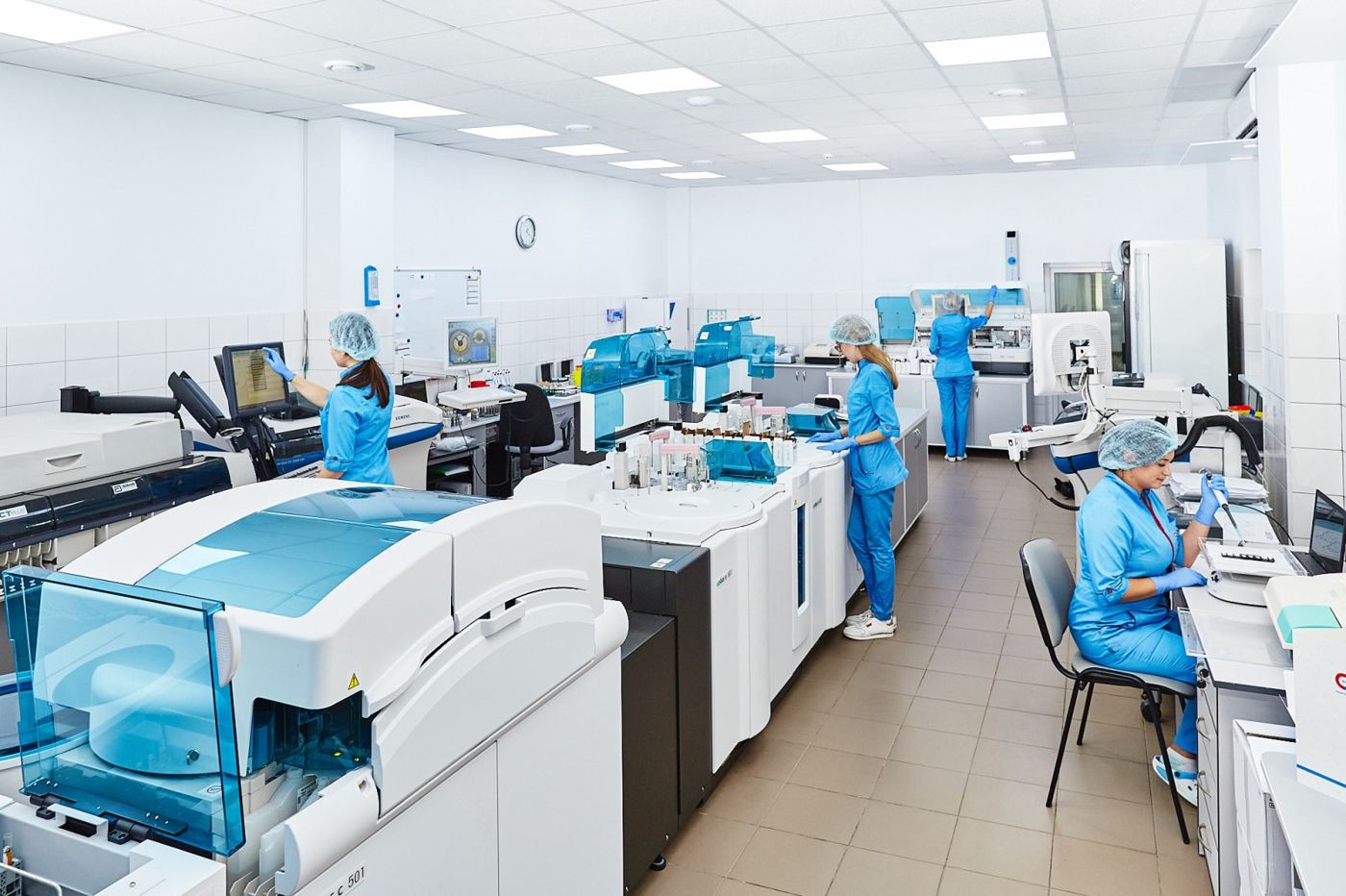 A researcher looking through a microscope in a laboratory