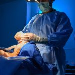 Surgeon performing an operation in an operating room