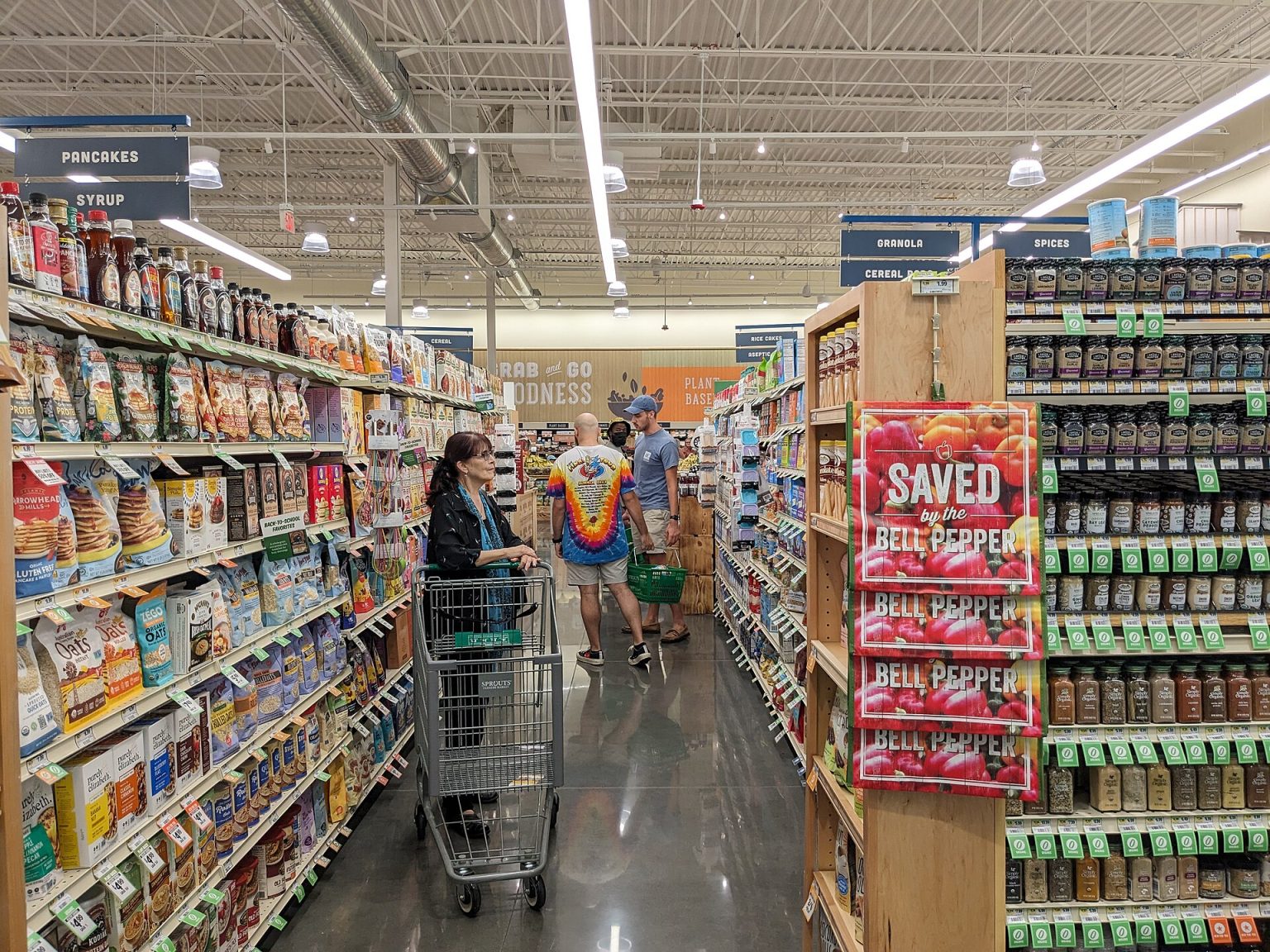 Shelves of packaged foods in a supermarket aisle.