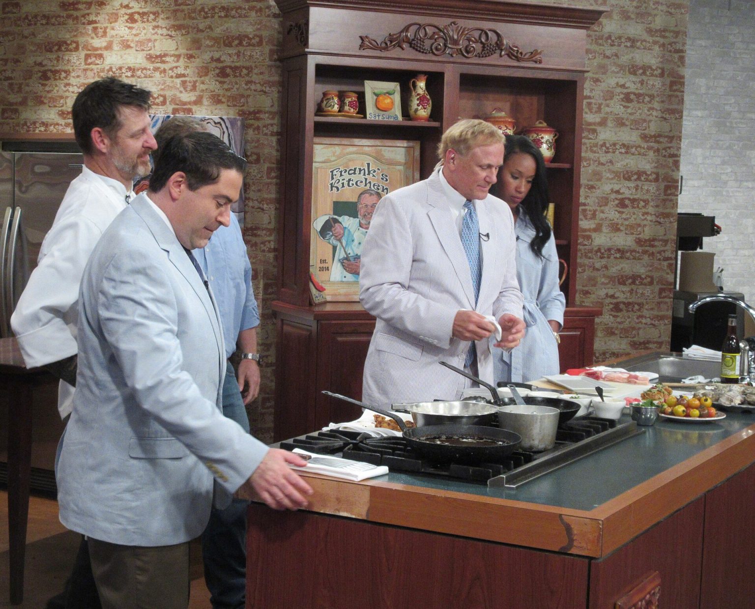 A cooking demonstration being filmed on a morning television show.
