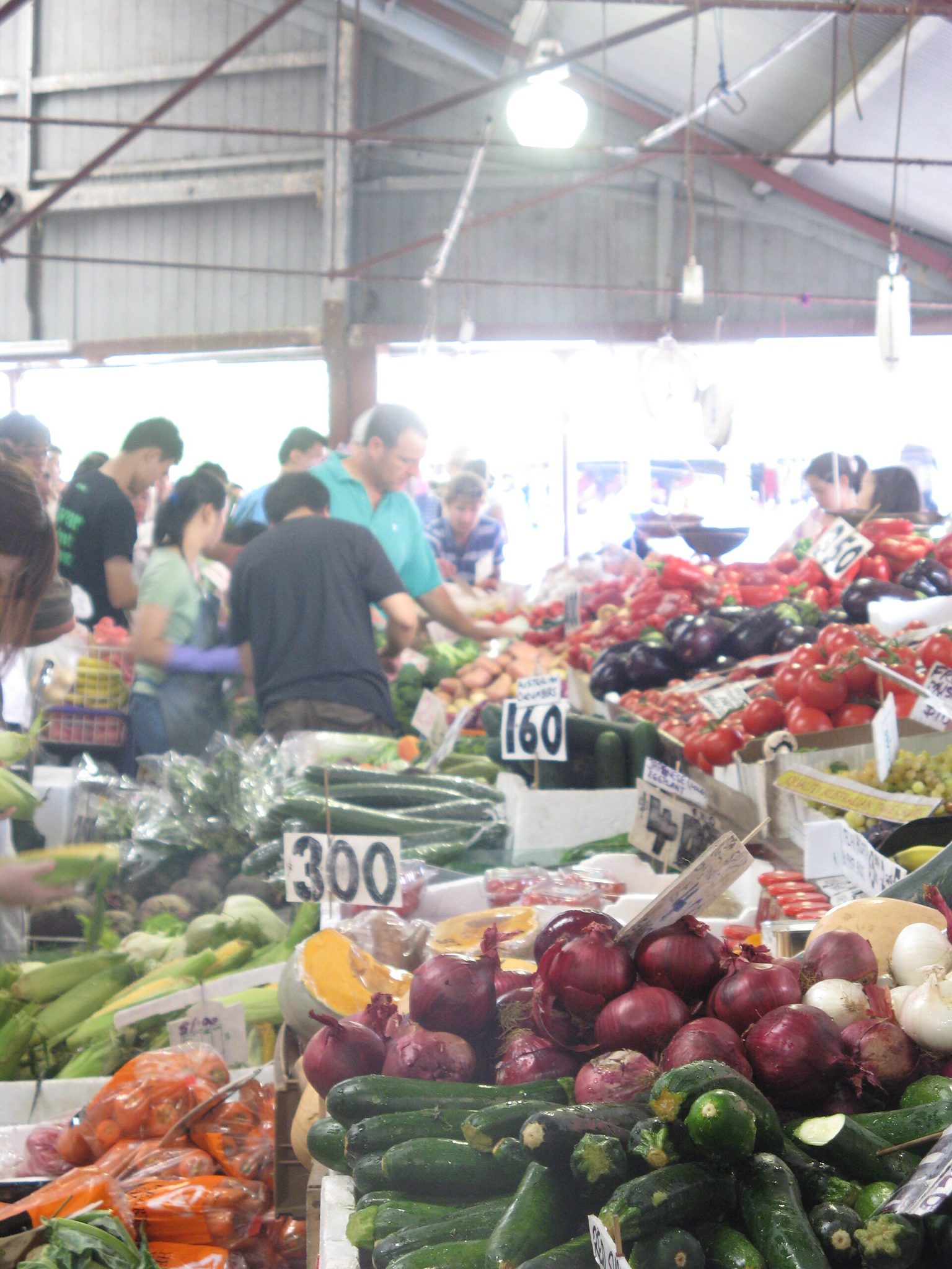 Fresh vegetables arranged on a market stall